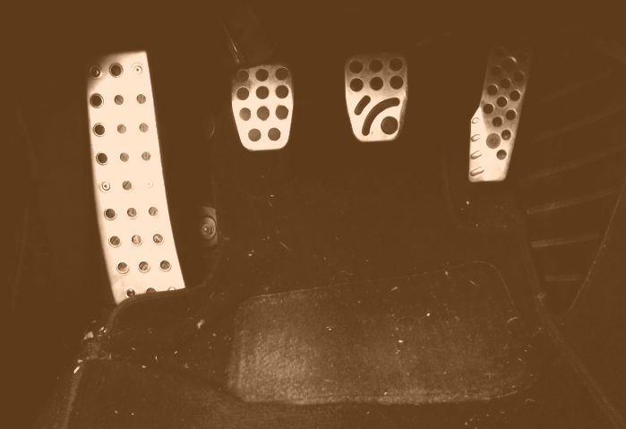 photo of pedals of a manual shift car